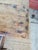 Rustic coffee table is constructed from solid teak wood with a natural, weathered finish. It has two functional drawers...