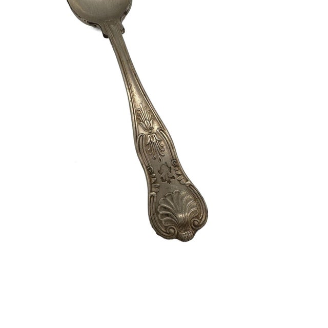 English hallmarked Sterling Silver large serving spoon adorned with the renowned KING'S pattern. Variations of the KING's...