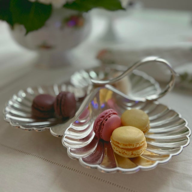 Effortlessly chic and rich in English heritage, this three-compartment silver plate shell tray by celebrated Birmingham...