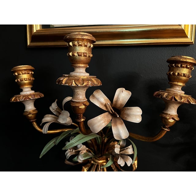 Gorgeous pair of Italian gilt candle sconces from Italy. Metal flowers and vibrant colors make these a real showstopper.