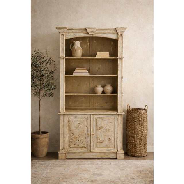 This lovely cabinet is impressive st 95 inches in height. It is most likely Italian and has rustic French styling with a...
