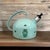 This antique tea kettle is a 1930's-1960's piece by Diepenbrock and Reigers of Ulft, Holland. Measuring 10-1/2" long and...