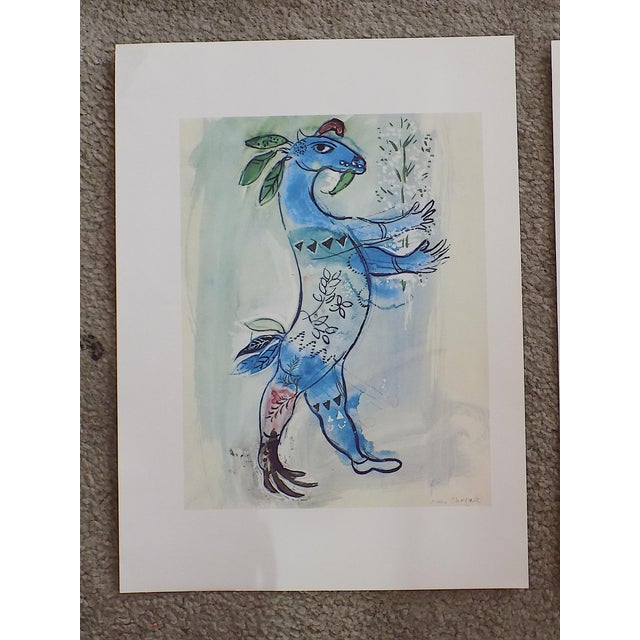 This pair of (2) vintage iconic modernist images by the world famous artist Marc Chagall (Russia/France 1887-1985) was...