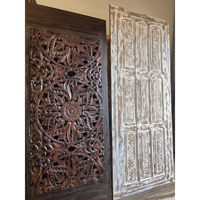 Make a striking architectural statement with this vintage carved wood sliding barn door, finished in a beautifully...