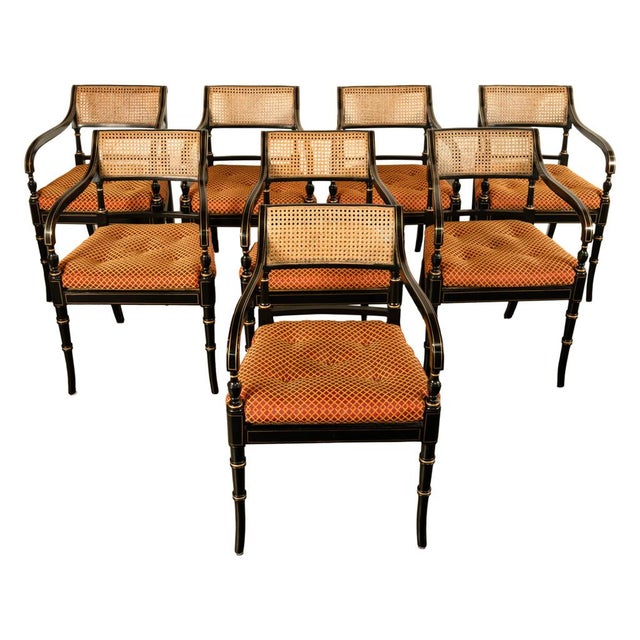 A fine set of eight Federal style gilded & japanned dining chairs by Kittinger Furniture Co., Kittinger was founded in NY...