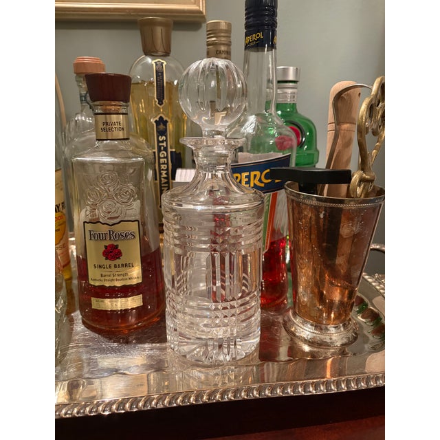 A bar cart without a crystal decanter is like a queen without a crown. Anything in this glimmering stunner will look top...