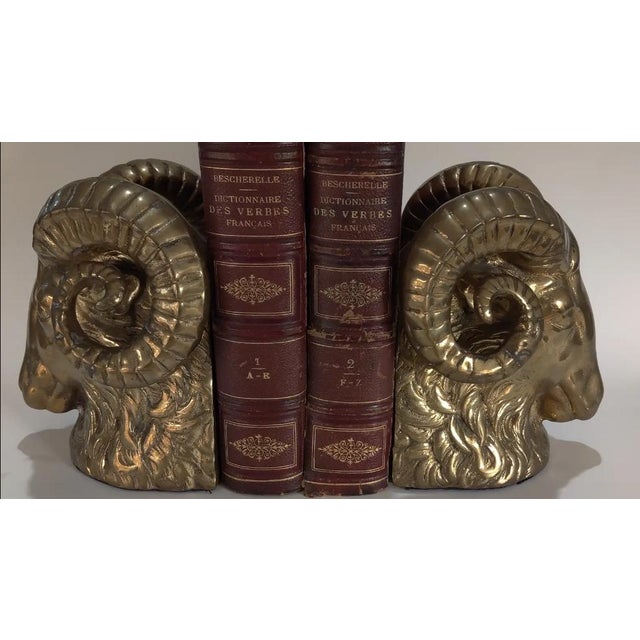 An extremely rare pair of heavy brass Ram's Head Bookends. Each ram's head is realistically sculpted depicting their thick...