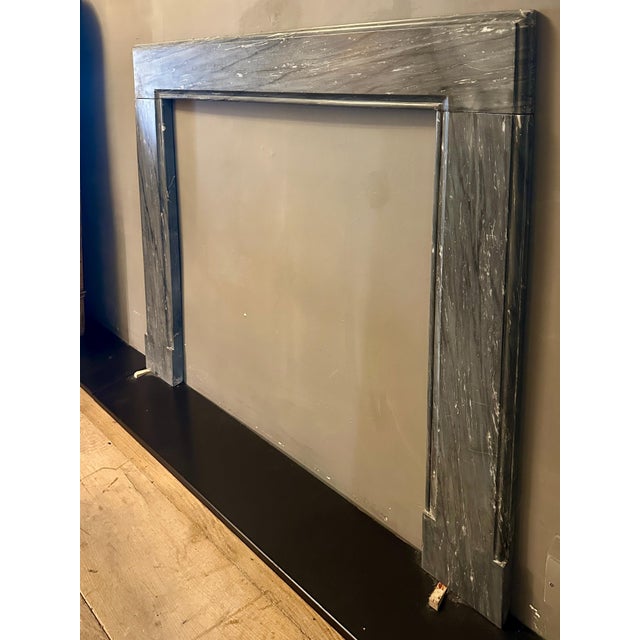 A simple Georgian style fire surround in Italian Bardiglio grey veined marble, outer and inner mouldings. The jambs with...