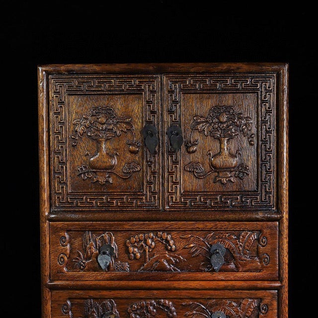 An exquisite vintage Chinese miniature cabinet crafted from Huali (rosewood) with a rich, warm patina. This stunning piece...