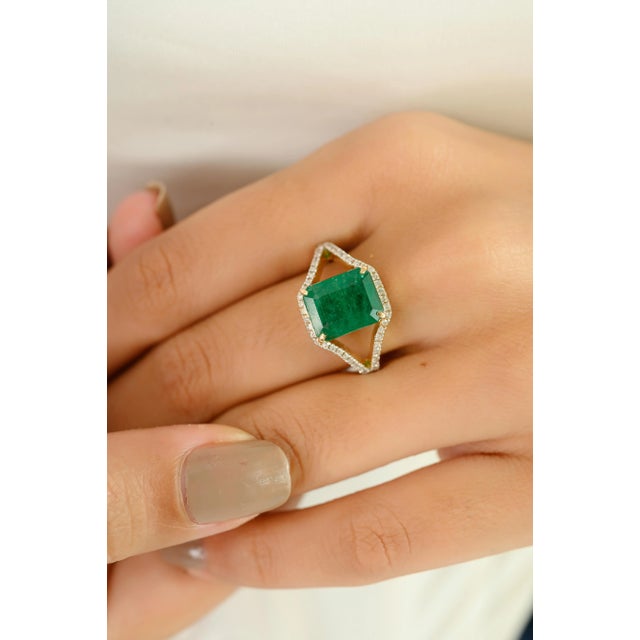 Radiating timeless elegance, this exquisite ring is crafted in rich 14k yellow gold and features a captivating 3.36 carat...