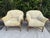 A beautiful pair of McGuire lounge chairs featuring sculptural rattan frames, gracefully curved arms, wrapped joints, and...