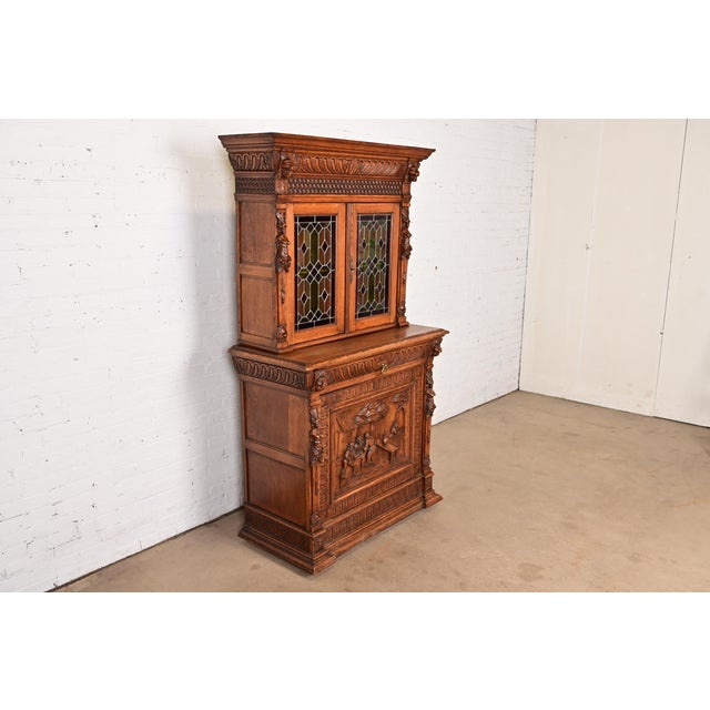 R. J. Horner & Co. Antique French Renaissance Revival Carved Oak Breakfront Bookcase or Bar Cabinet With Stained Leaded Glass Doors, Circa 1890s For Sale - Image 4 of 14