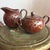 Mid Century Japanese creamer and sugar bowl with a lovely detailed flower vine motif in a rake glaze finish. In excellent...
