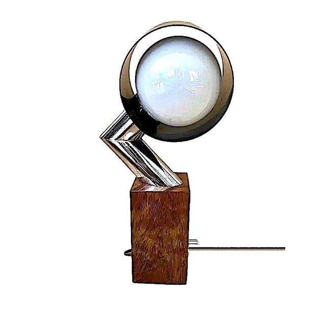 This striking piece is an authentic Mid-Century Modern Space Age table lamp that originated in Italy during the mid-20th...