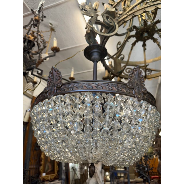 This elegant neoclassical crystal chandelier is the perfect blend of classical charm and refined sparkle. Though modest in...