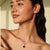 Crafted in 925 sterling silver, this stunning Black Star pendant showcases a 5.71 carat round gemstone accented by...