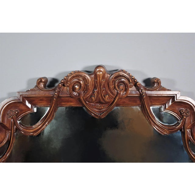 Mirror with frame in carved wood. With green fabric and clock with little glass door and brass, 60s.