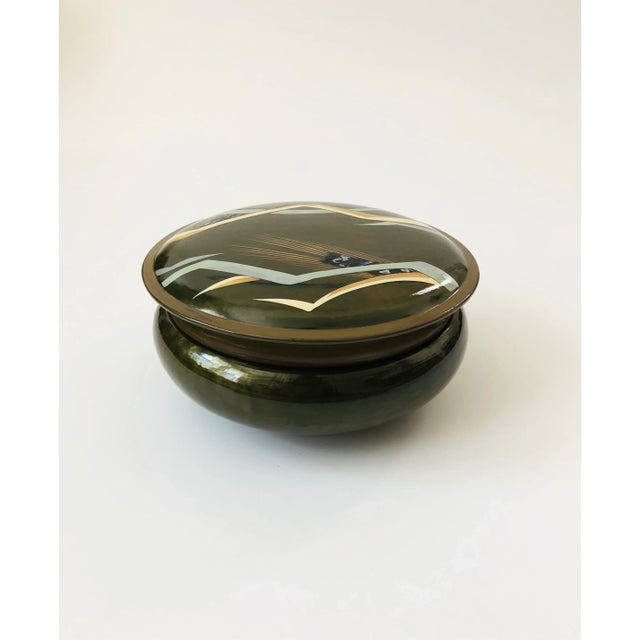 A vintage lacquerware tray set in a matching box. Beautiful olive green stain to the wood with handpainted details and...