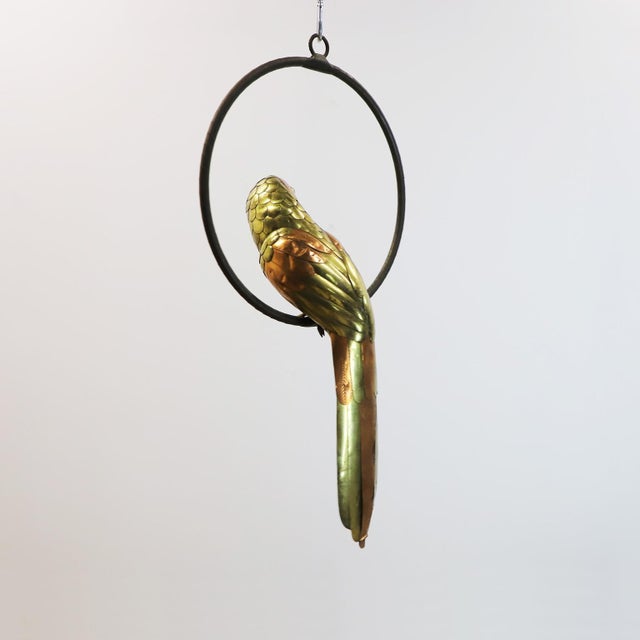 We offer this macaw sculpture by Mexican artist Sergio Bustamante, circa 1960 made in brass and copper with fantastic...