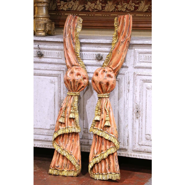 Bring dramatic French theatrical charm to a wall with this impressive pair of antique carved and painted curtain tieback...