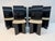 Elegant set of six Italian dining chairs featuring sleek black lacquered frames and a refined, sculptural silhouette. The...
