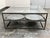 Design Plus Gallery presents the Tilford Glass Top Tray Coffee Table from Blue Ocean Trader. The coffee table has a...