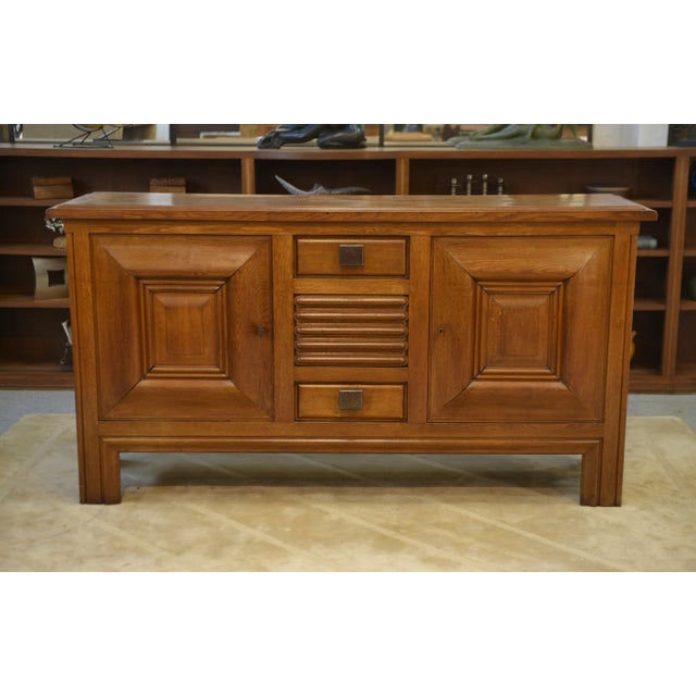 Oak and Wrought Iron Buffet by Charles Dudouyt, 1940s, in Very Good conditions. Designed 1920 to 1949 This piece has an...