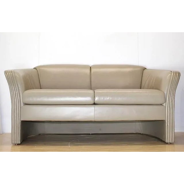 Sandy color, superior quality soft leather with rolled arms. great design and comfortable. Vintage Patrician Furniture....
