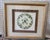 A beautifully coordinated pair of framed botanical still-life prints by celebrated American artist Carolyn Shores Wright,...