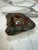 Hand-carved marble ashtray featuring rich burgundy, forest green, amber, and smoky gray tones. The polished bowl contrasts...