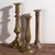 Antique brass candlesticks (c.1920) Dimensions: Piece #1: Diameter: 11 cm Height: 30 cm Piece #2: Diameter: 10 cm Height:...