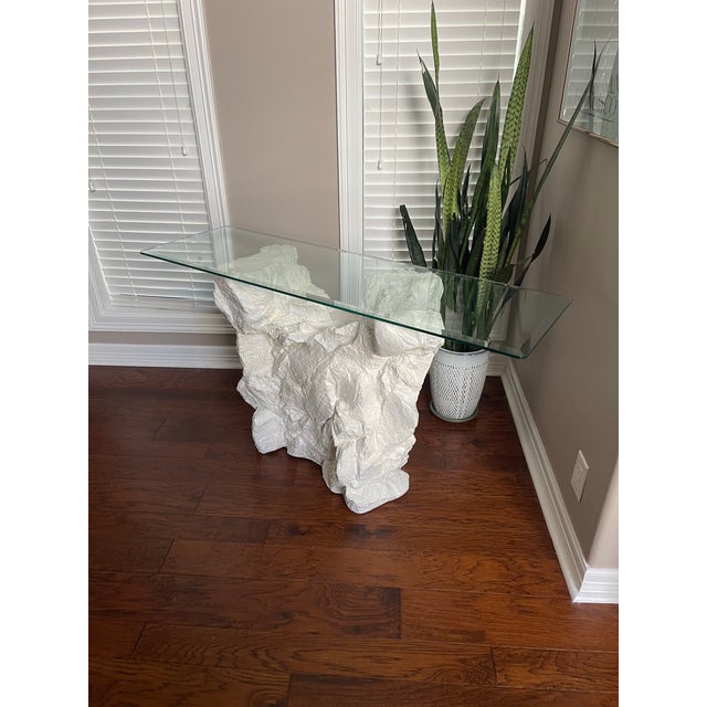 A plaster, faux rock console table by Sirmos in the 1970s/1980s, with attributions to Emilio Terry and Serge Roche. This...