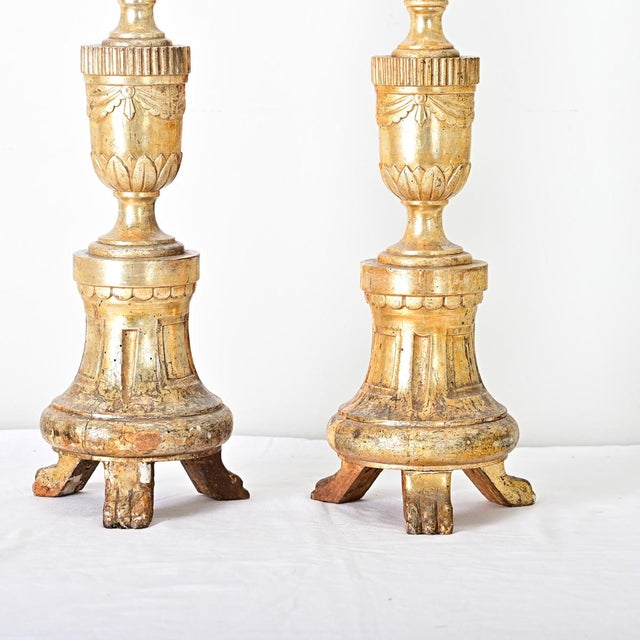 A stunning pair of French, 18th century giltwood candlesticks from a church or cathedral. These substantial "pricket"...