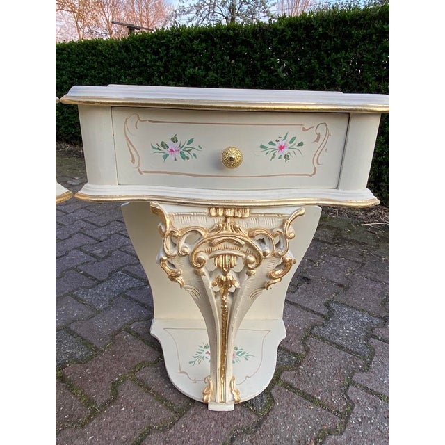 A rare and beautifully restored pair of 1899 Italian Rococo / Baroque Revival nightstands, crafted from solid beech wood...
