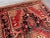 Tribal Antique Caucasian Medallion Rug in Red and Charcoal Hand-Knotted Low Pile Distressed Tribal Carpet For Sale - Image 3 of 13