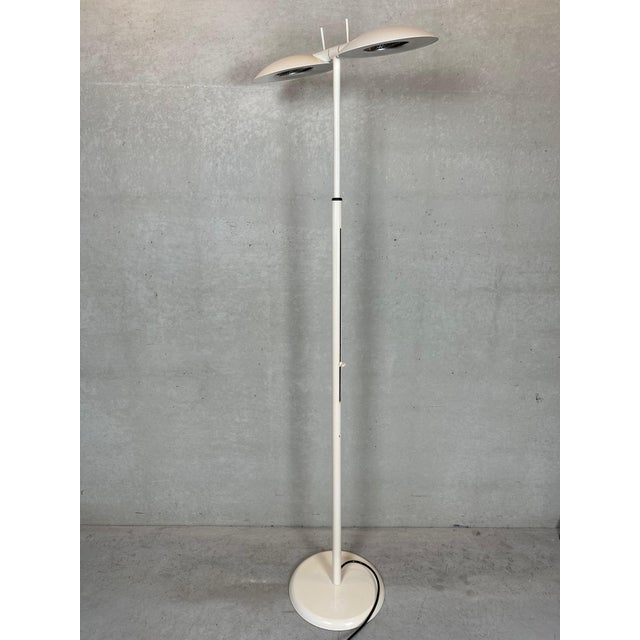 Nicely designed uplighter. 2 adjustable metal lampshades. Metal support, adjustable in height from 150 to 200cm. Dimmer...