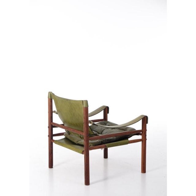Excellent safari chair / easy chair model Sirocco in green leather designed by Arne Norell. Produced by Arne Norell Möbel...
