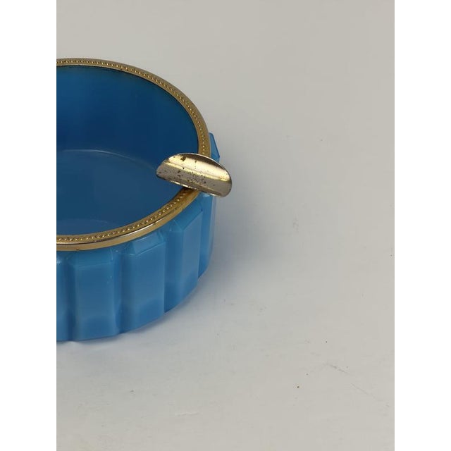 A turquoise opaline glass ashtray attributed to Vincenzo Nason, made in Italy during the 1950s, featuring a circular form...