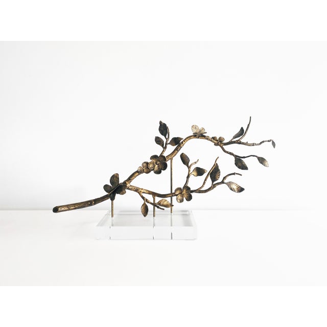 Introducing the exquisite Leaf & Blossom Vine Sculpture, elegantly mounted on acrylic and finished in a timeless Aged Gold...