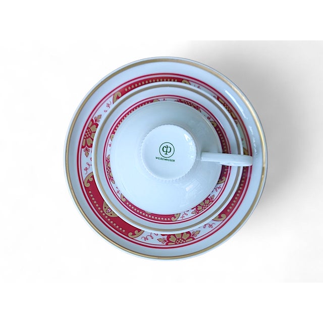 This elegant three-piece collector's cup and saucer set from cp weißwasser combines the decorative design language of east...