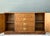 This vintage Drexel Campaign sideboard combines a warm wood finish with brass hardware and a clear, balanced silhouette....