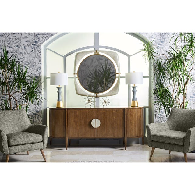 Crafted from premium American walnut with a transparent lacquer finish, this serpentine front sideboard showcases a...