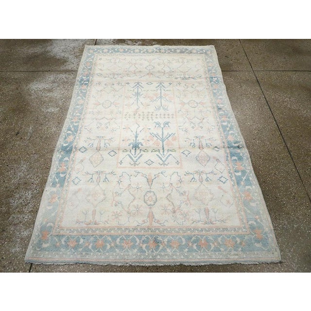 A vintage Indian cotton Agra from the mid-20th century. Measures: 4' 1" x 6' 6"