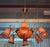 Pair of Art Nouveau Bronze and Orange Glass Paste Chandeliers A remarkable pair of Art Nouveau chandeliers in bronze with...