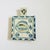 A lovely vintage hand painted ceramic trivet. Feature a fish design in blue and white glazes with a handle on one end....