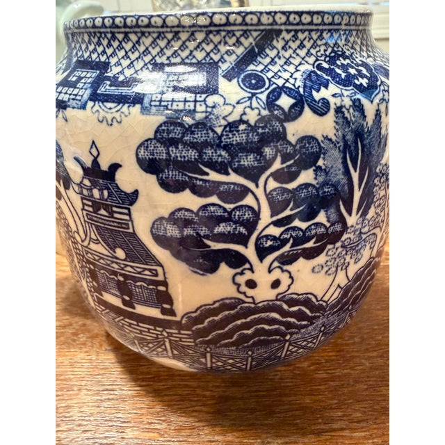 Charming vintage Japanese Blue Willow teapot featuring a classic cobalt blue and white chinoiserie landscape with pagodas,...