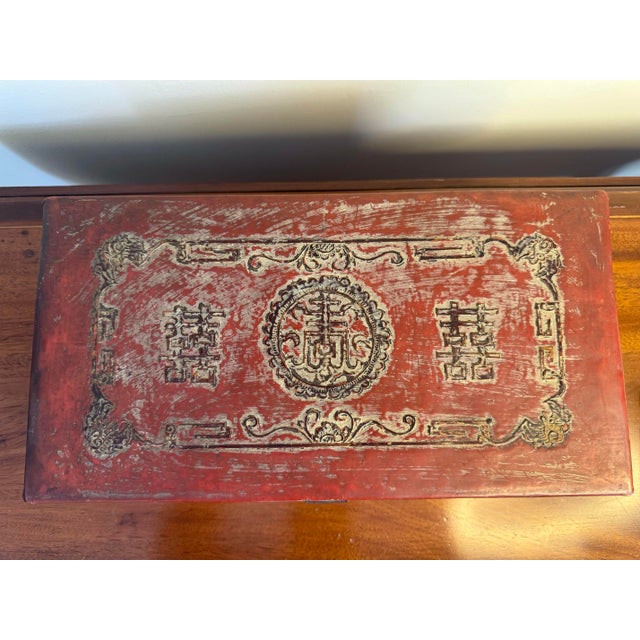 A striking antique Chinese red leather-covered wooden box, attributed to the Late Qing Dynasty to Early Republic period,...