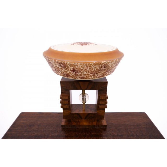 A beautiful table lamp from the mid-20th century in the Art Deco style. The style is characterized by simple design,...