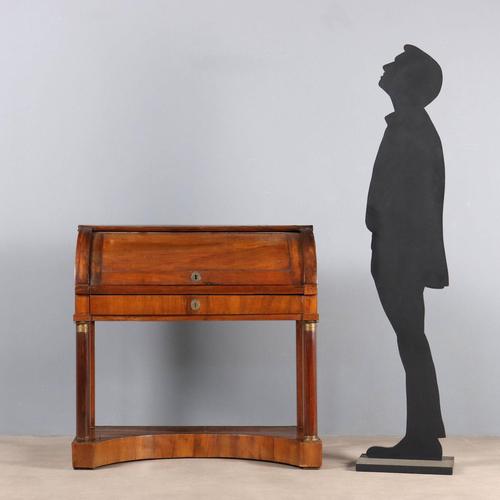 Empire walnut roll-top desk. Drawer in the lower section, internal cabinet with open compartment and four drawers, turned...
