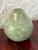Decorative metal pear with the look of verdigris over copper. Simple and sculptural, it sits nicely on a stack of books, a...